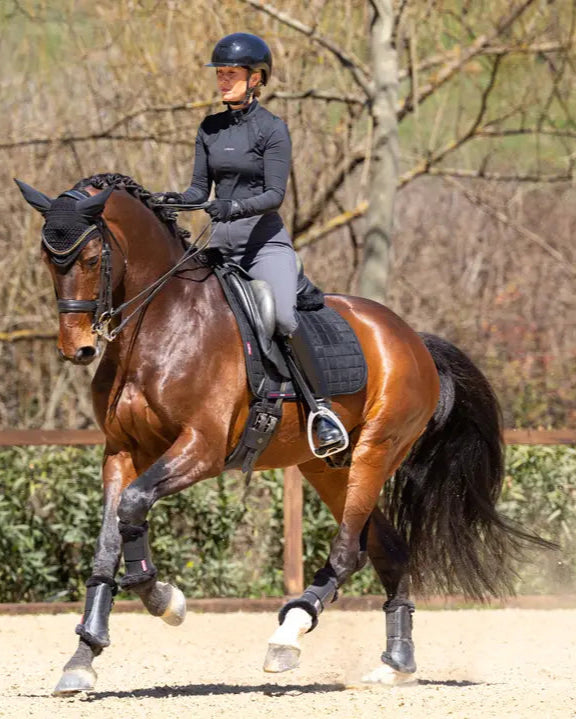 Dressage horse & rider, LeMieux Diamante Dressage Square black pad. Equestrian performance & style.