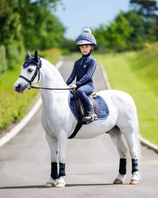 LeMieux Mini Fly Hood Indigo on pony with rider. Kids equestrian ear net for ponies. Matching set.