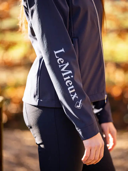 LEMIEUX Young Rider Elite Soft Shell Jacket Navy | Equestrian jacket with branding on the sleeve.