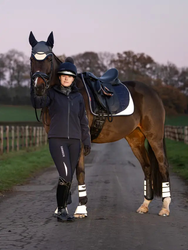 Equestrian fashion: Rider and horse with Lemieux gear. Stylish horse riding equipment.