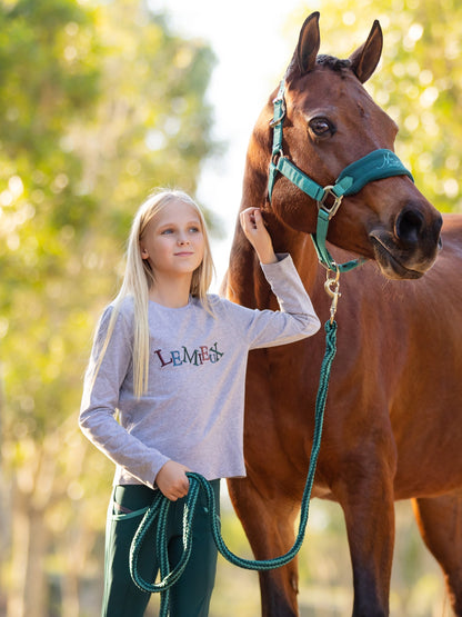 Girl with horse wearing Lemieux Mini Jamie Long Sleeve Top Grey: Children's Equestrian Fashion