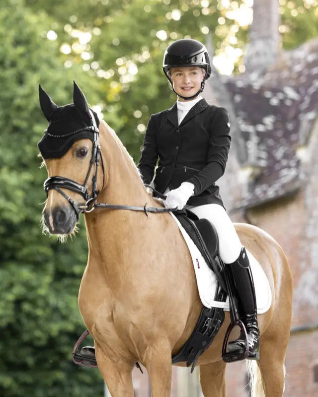LeMieux Junior Pro Show Jacket in Black on Rider and Horse - Equiflair