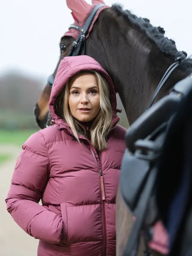 Woman in LEMIEUX KENZA Orchid Puffer Jacket with Horse - Equiflair - equestrian fashion, warm coat, outdoor style