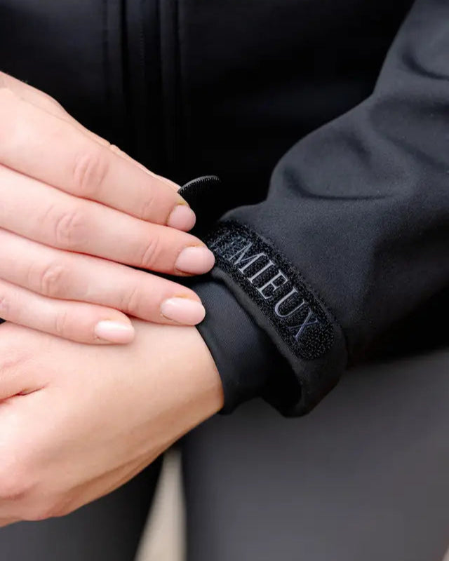 LEMIEUX CELINE Black Softshell Jacket: Adjustable Cuffs for Riding & Outdoor - Equiflair