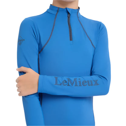 LEMIEUX Young Rider Base Layer Benetton Blue: UV50+, Quarter Zip, Long Sleeve Performance Shirt for Horse Riding. Shop at Equiflair!