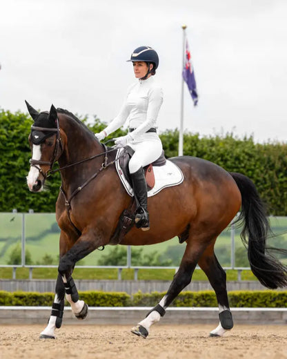 Dressage Horse & Rider with LeMieux Loire GP Square White Saddle Pad. Equiflair