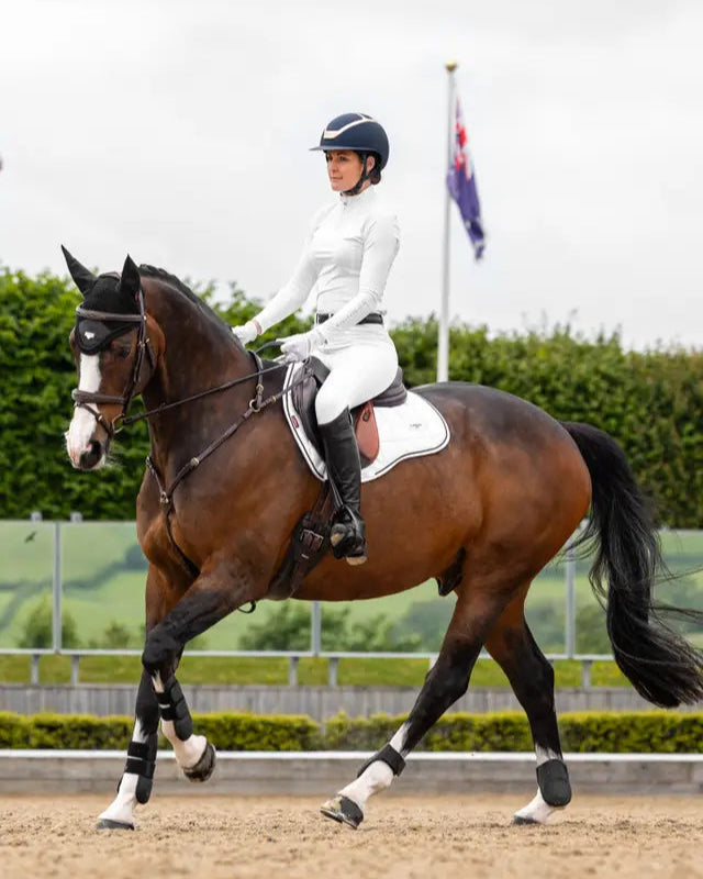 Dressage Horse & Rider with LeMieux Loire GP Square White Saddle Pad. Equiflair