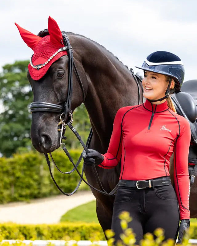 Lemieux Loire Fly Hood Chilli on Horse with Rider - Equiflair: Stylish protection from flies, dust, and distractions.