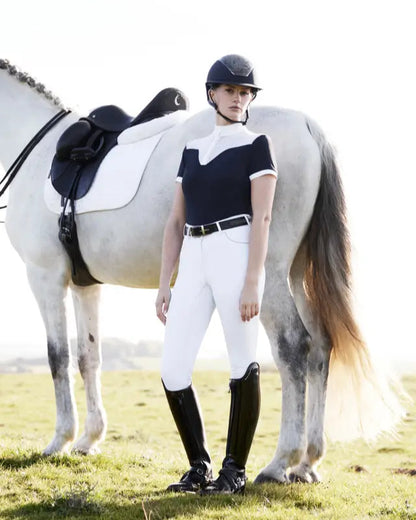 Equestrian Fashion: Woman in LEMIEUX Show Shirt, White Breeches, Riding Boots Posing with Horse