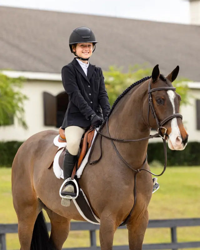 LeMieux Merino+ Hunter Saddle Pad in White on Horse with Equestrian Rider. Show Jumping.