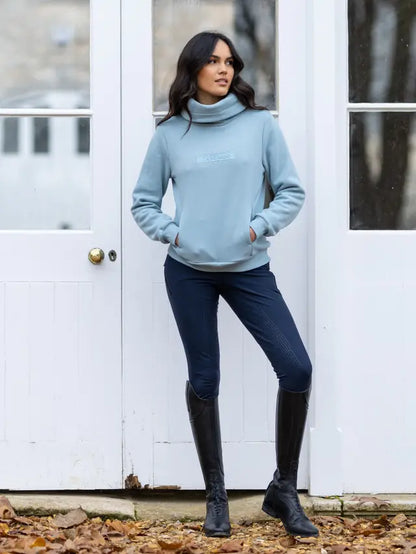 LEMIEUX ADELE FUNNEL NECK SWEAT GLACIER: Stylish blue funnel neck sweatshirt by Equiflair for women. Comfortable and ideal for layering.
