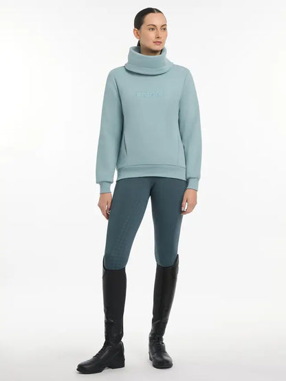 LeMieux Adele Glacier Funnel Neck Sweatshirt: Comfortable equestrian style with pockets & layered look. Riding outfit.