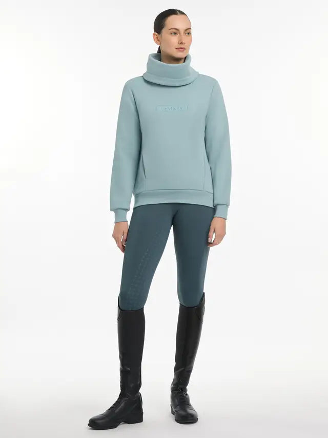 LeMieux Adele Glacier Funnel Neck Sweatshirt: Comfortable equestrian style with pockets & layered look. Riding outfit.