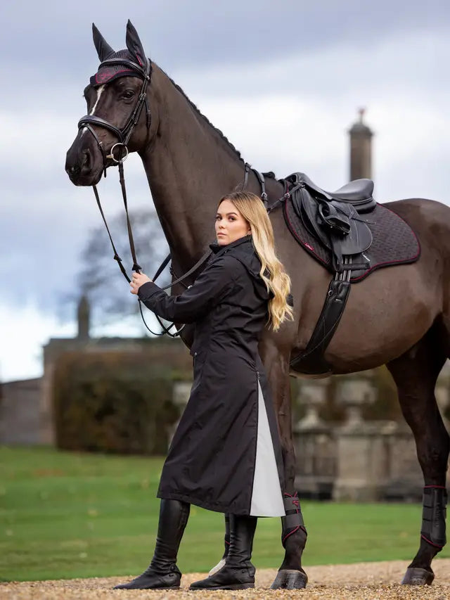 Equestrian Fashion: Woman in LeMieux Amelie Waterproof Riding Coat with Horse