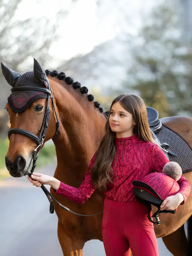 Girl with Horse in LEMIEUX Young Rider Casey Base Layer Ember | Equestrian Riding Gear