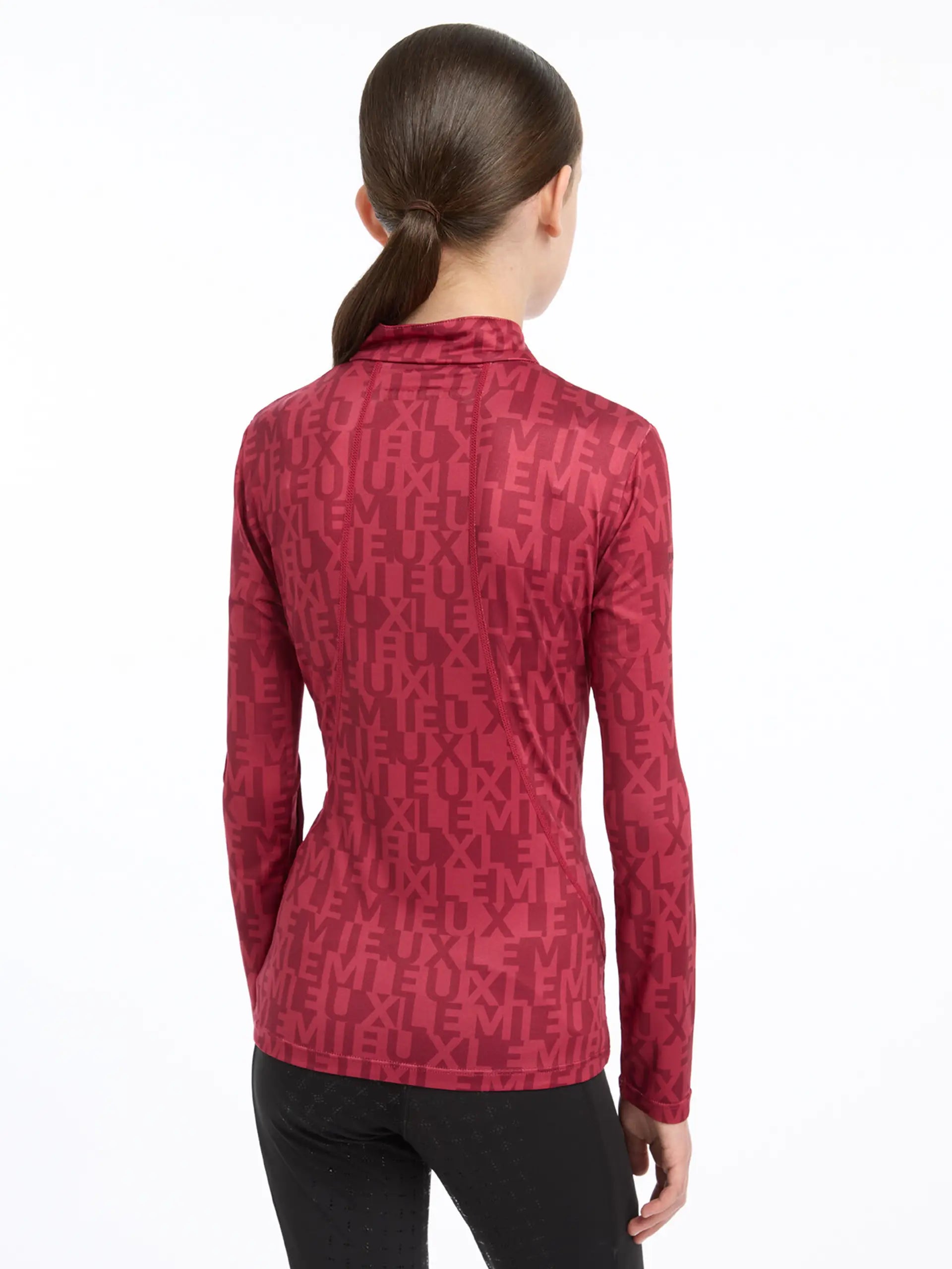 LeMieux Young Rider Casey Base Layer - Ember. Equiflair base layer, quarter zip, UV30+, moisture-wicking. Style & performance!
