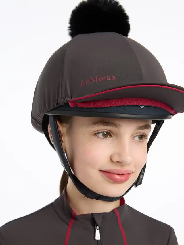 LEMIEUX PIPPA HAT SILK Cinder: Equestrian riding helmet silk with faux fur pom pom.