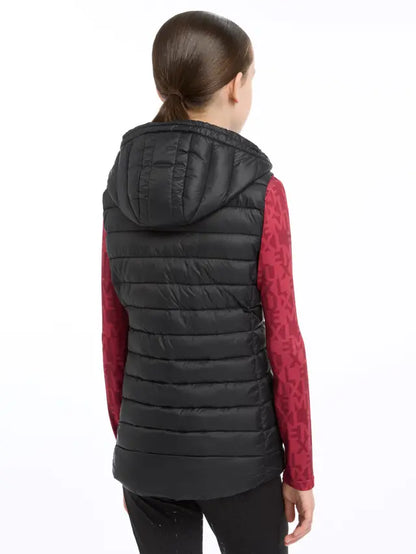 Lemieux Young Rider Milly Black Puffer Gilet with Hood. Girl wearing children's black puffer vest from behind.
