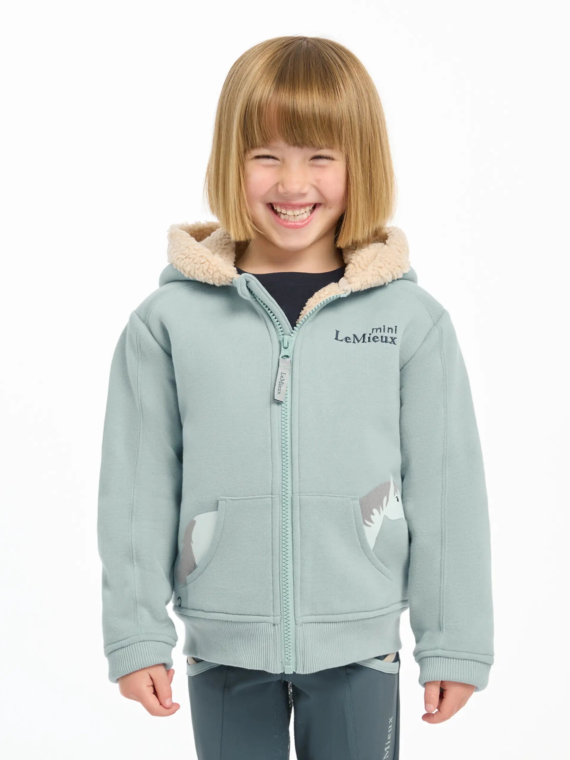 LeMieux Mini Charlie Lined Hoodie Glacier: Child in adorable equestrian clothing with horse accents & cozy hood. Equiflair Store