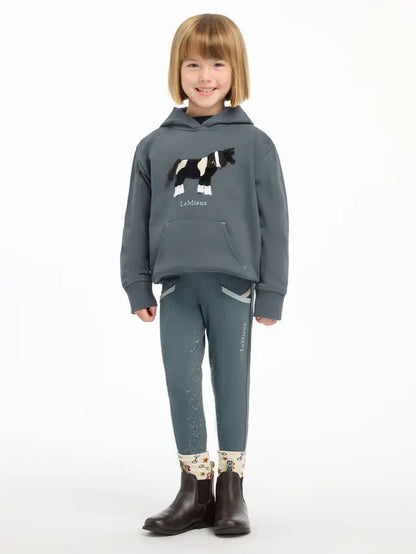 LEMIEUX MINI ROMI HOODIE Petrol: Girl wearing hoodie with horse appliqué. Equiflair.