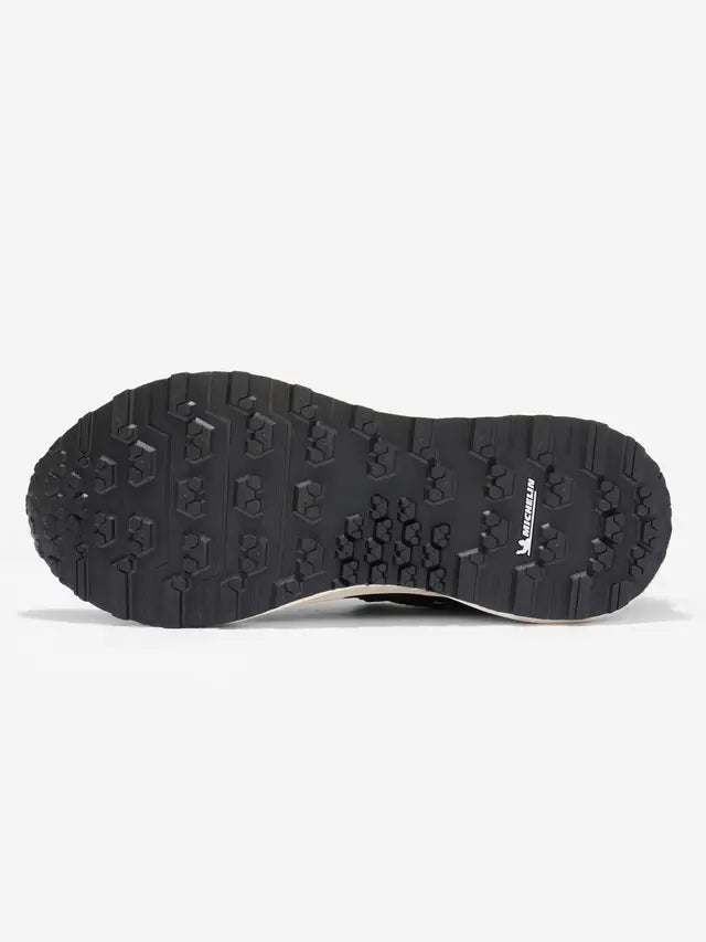 Lemieux Trax Waterproof Trainer: Michelin Sole Detail. Black Equestrian Trainer Shoe Bottom View.