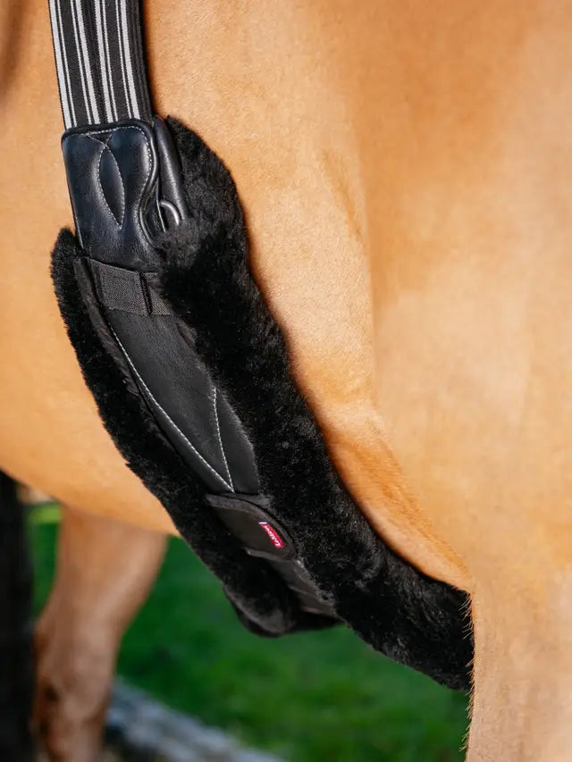 LeMieux Merino+ Anatomic Long Stud Girth Cover - Black. Comfortable, breathable horse riding equipment.