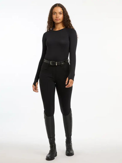 Lemieux Black Seamless Long Sleeve Riding Top. Woman wearing riding apparel. 