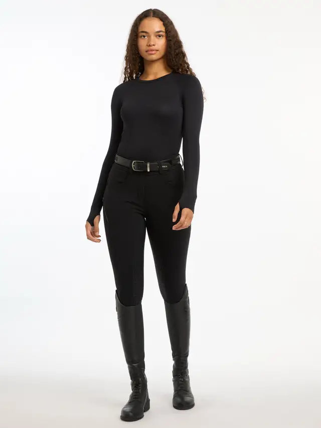 Lemieux Black Seamless Long Sleeve Riding Top. Woman wearing riding apparel. 