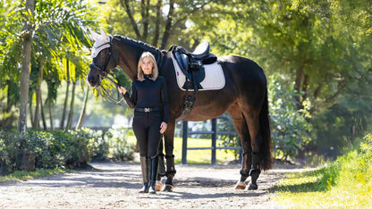LeMieux Essence dressage saddle pad in stone with woman and horse at Equiflair Saddlery.