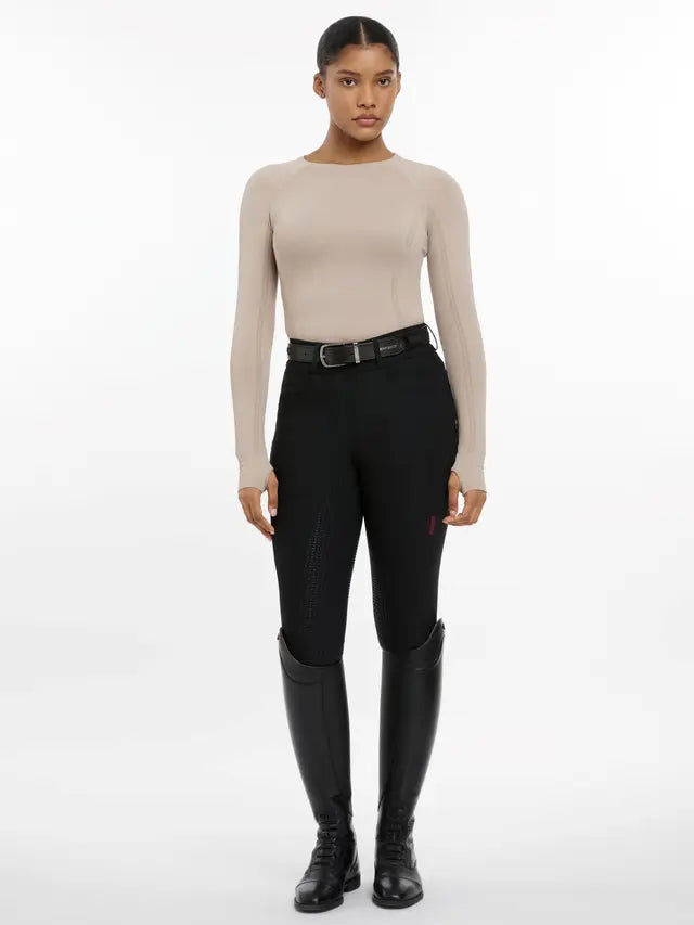 LeMieux Britney Almond Long Sleeve Riding Top: Seamless, Breathable, UV30+, Thumb Holes. Perfect for active equestrian wear.