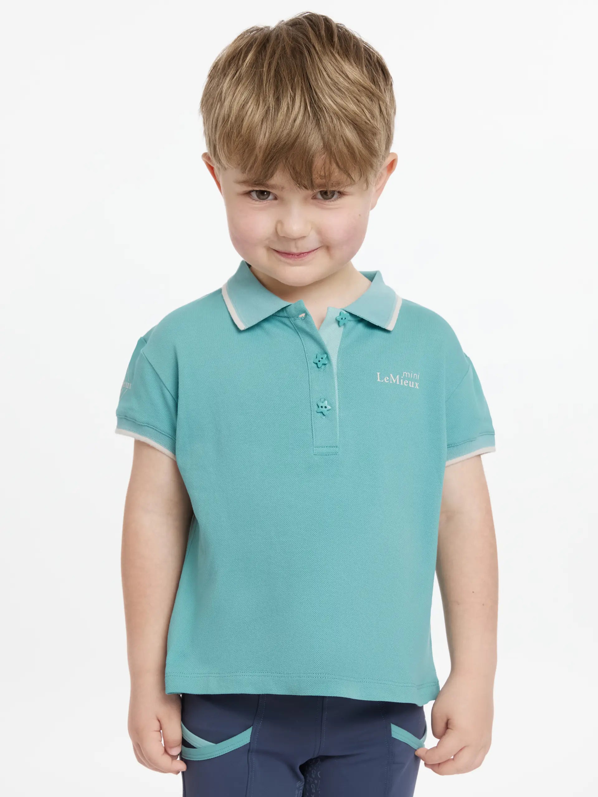 LEMIEUX MINI POLO SHIRT LAGOON: Boy in equestrian apparel. Available at Equiflair.