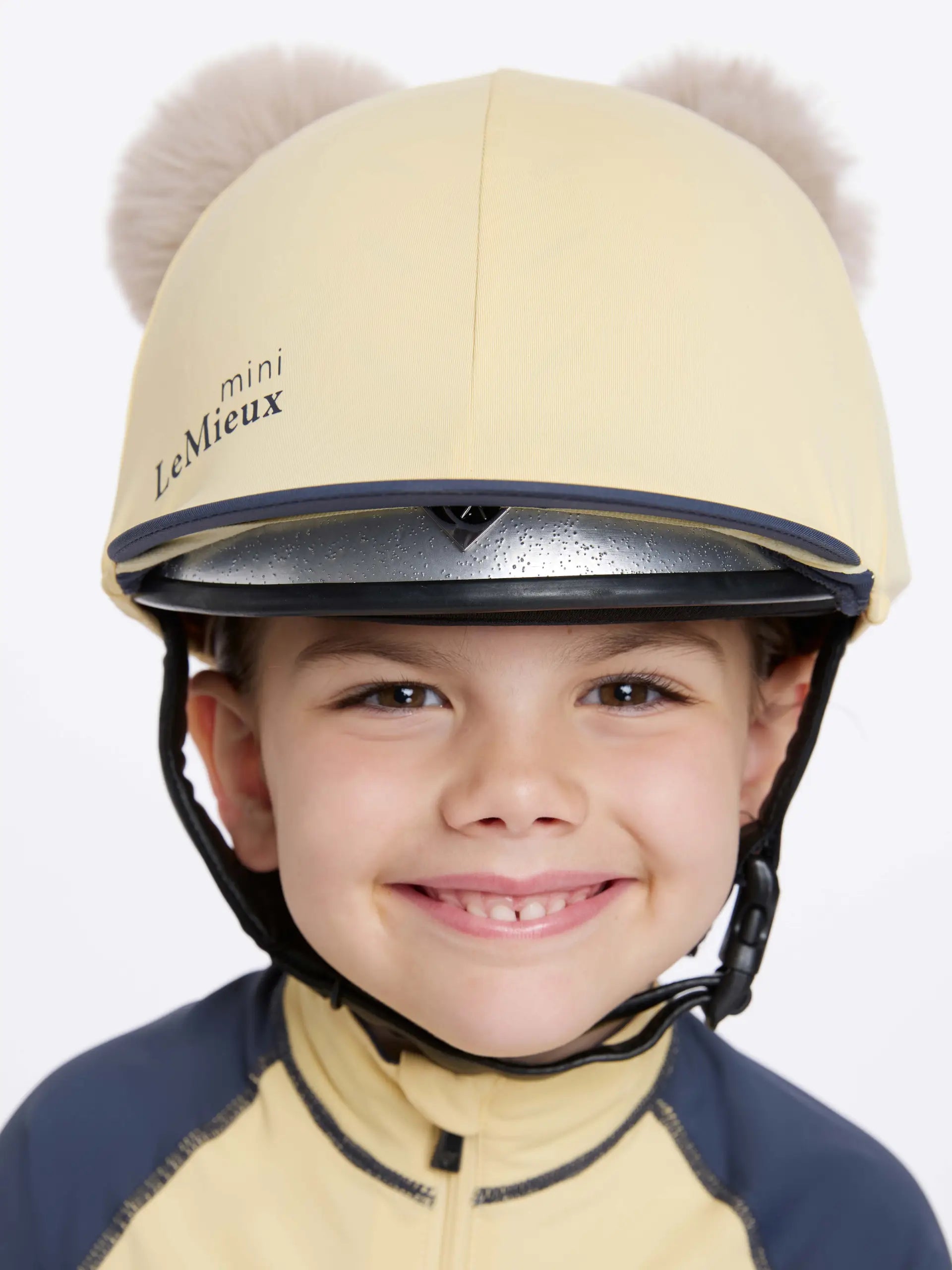 Child Equestrian: LeMieux Mini Mimosa Riding Helmet with Pom Poms. Cute and safe riding gear!