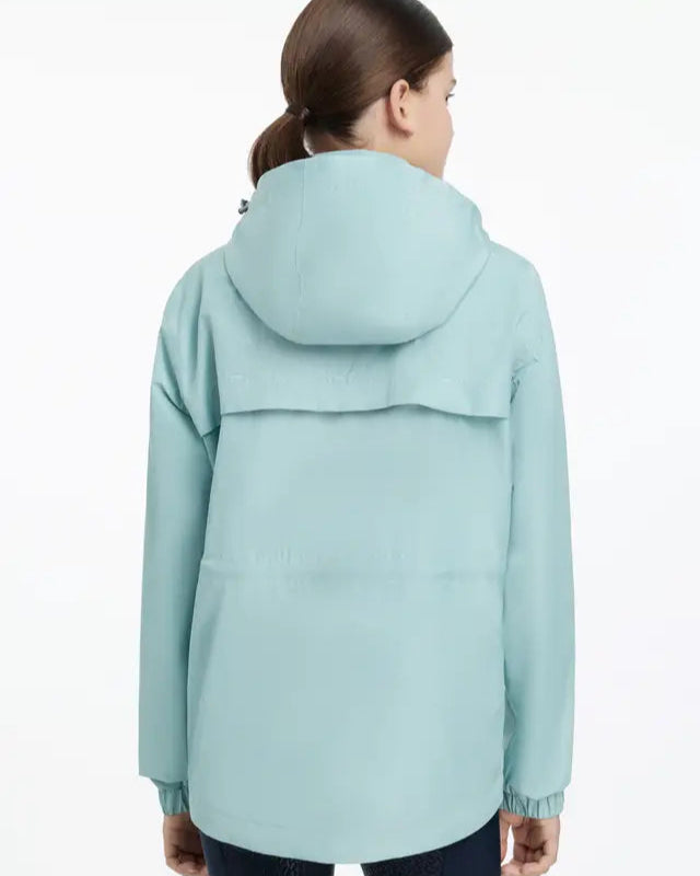 LEMIEUX YOUNG RIDER DOLCIE WATERPROOF JACKET AQUA - Girl wearing light blue waterproof jacket with hood.