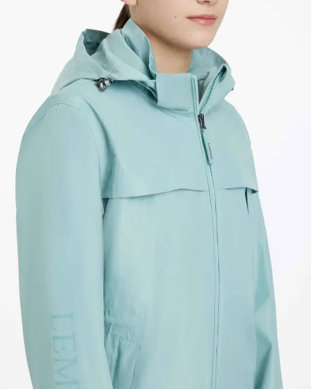 LeMieux Young Rider Dolcie Waterproof Jacket Aqua. Girl's aqua waterproof jacket with hood and zipper.