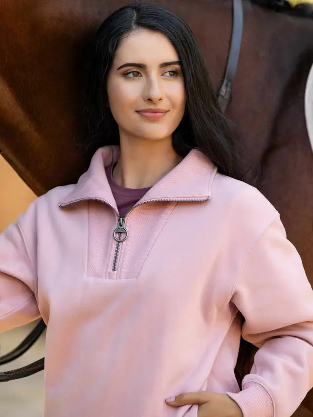 LeMieux Keira Quarter Neck Sweatshirt in Blossom with model and horse.