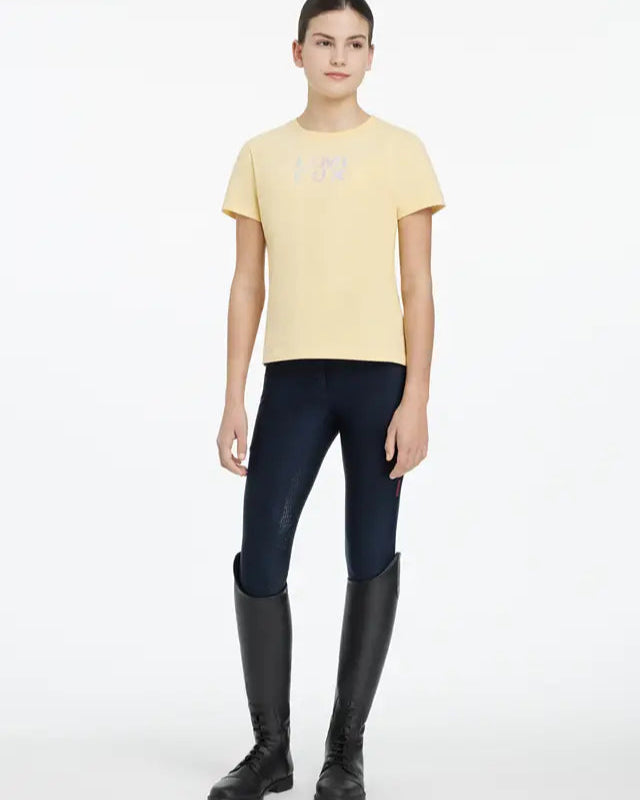 LeMieux Young Rider Arianna T-Shirt in Mimosa with Riding Leggings and Boots. Equestrian Apparel.