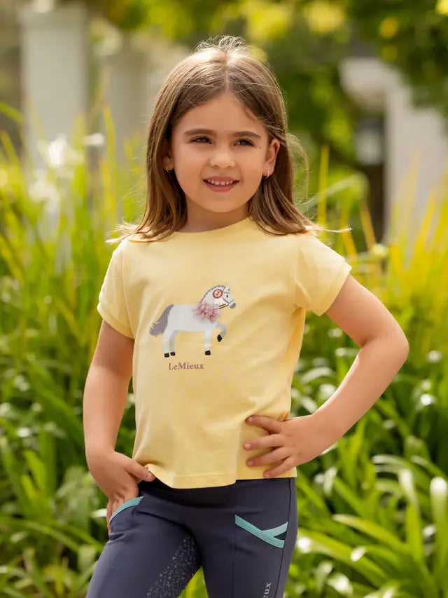 LeMieux Mini Alex Tee Mimosa: Girl's equestrian t-shirt with a cute pony design. Kids' LeMieux clothing from Equiflair.