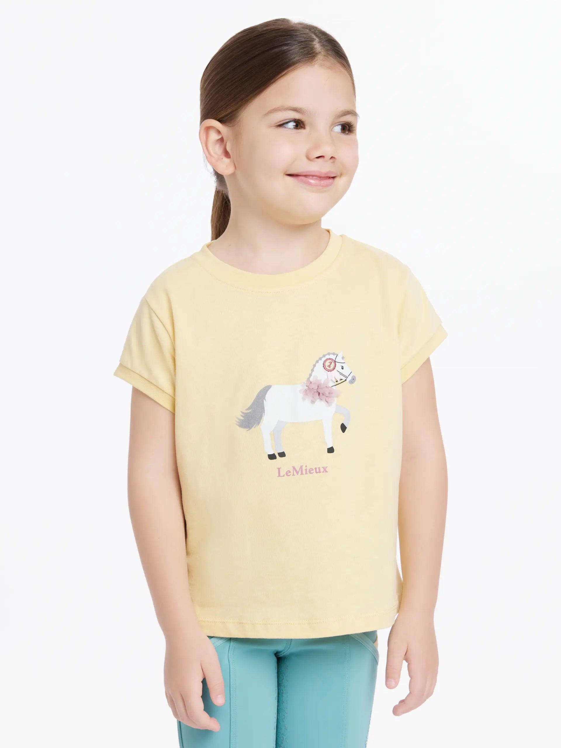 LeMieux Mini Alex Tee Mimosa: Girl in yellow pony t-shirt. Equestrian style for kids. Horse lover apparel.