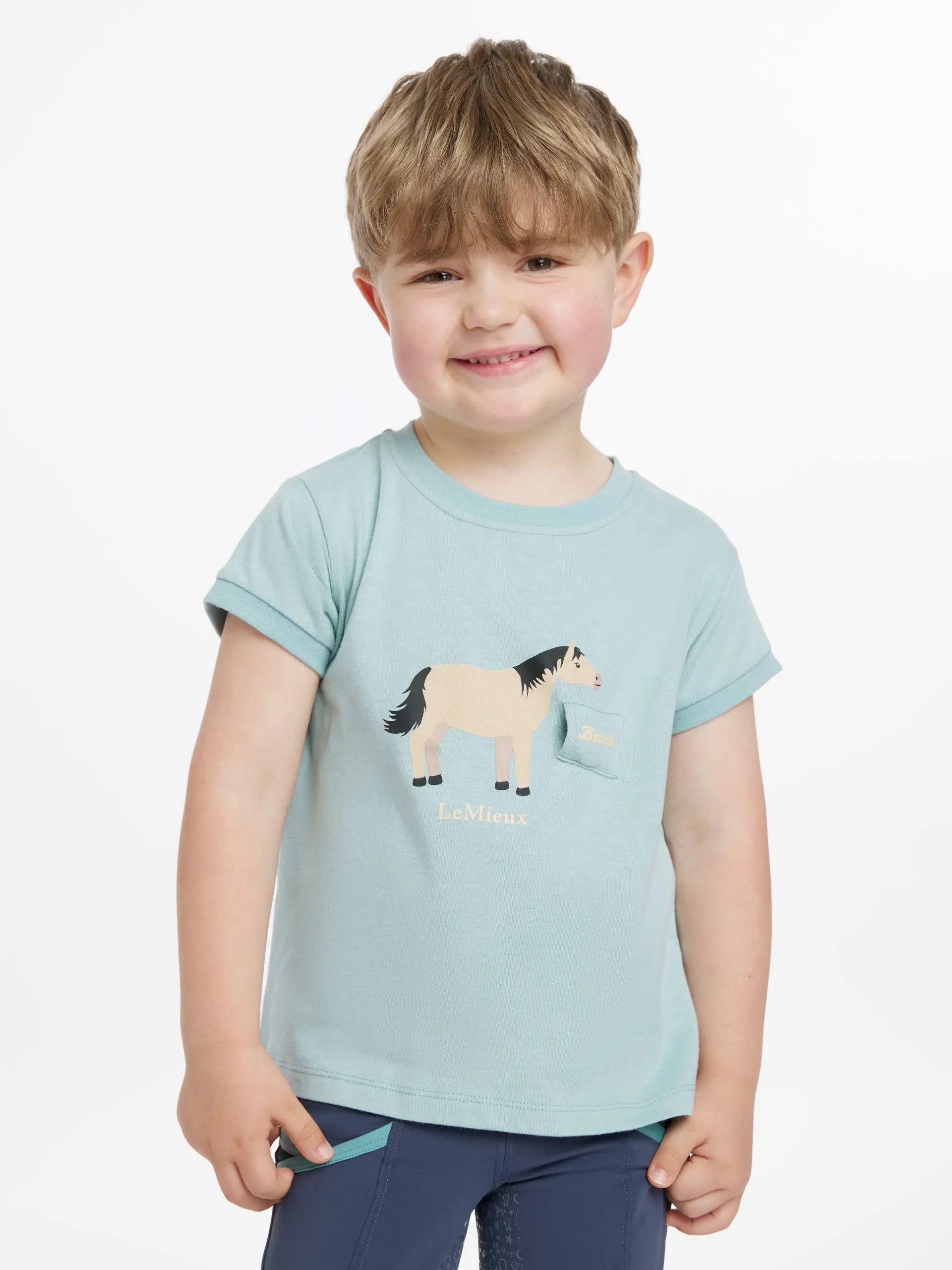 LeMieux Mini Alex Tee Aqua: Boy wearing kids' horse t-shirt. Children's Equestrian Apparel.