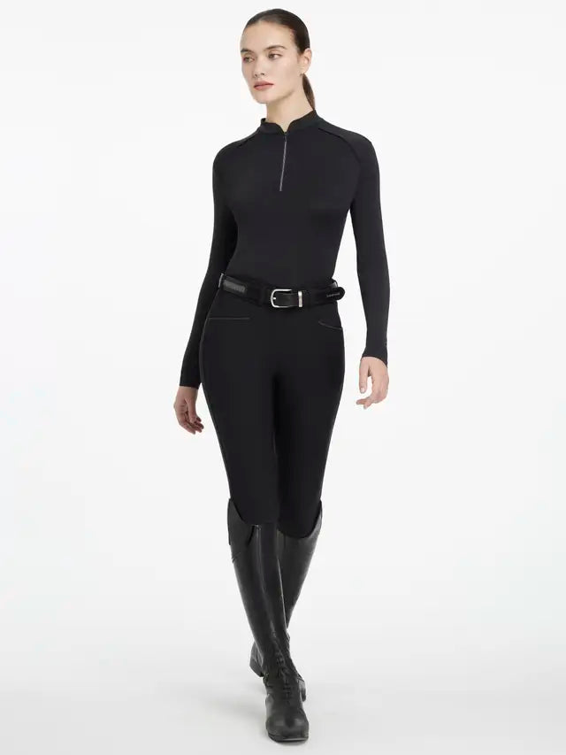 LeMieux Equestrian Base Layer Black: Lightweight riding top with 360° stretch, UV30+ protection, and cooling treatment. Stylish riding gear.