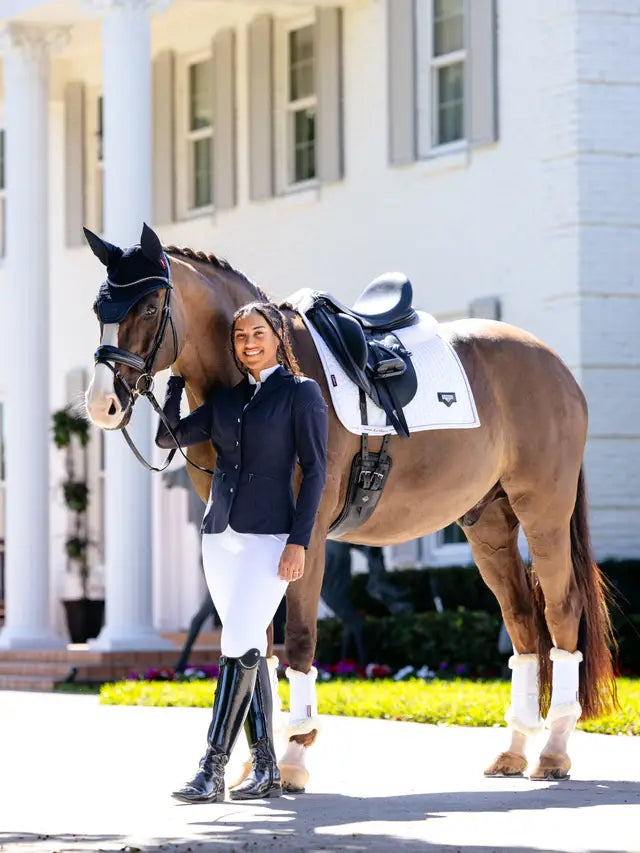 LeMieux Puissance Suede Dressage Pad in White on Horse with Rider | Equiflair Horse Riding Equipment