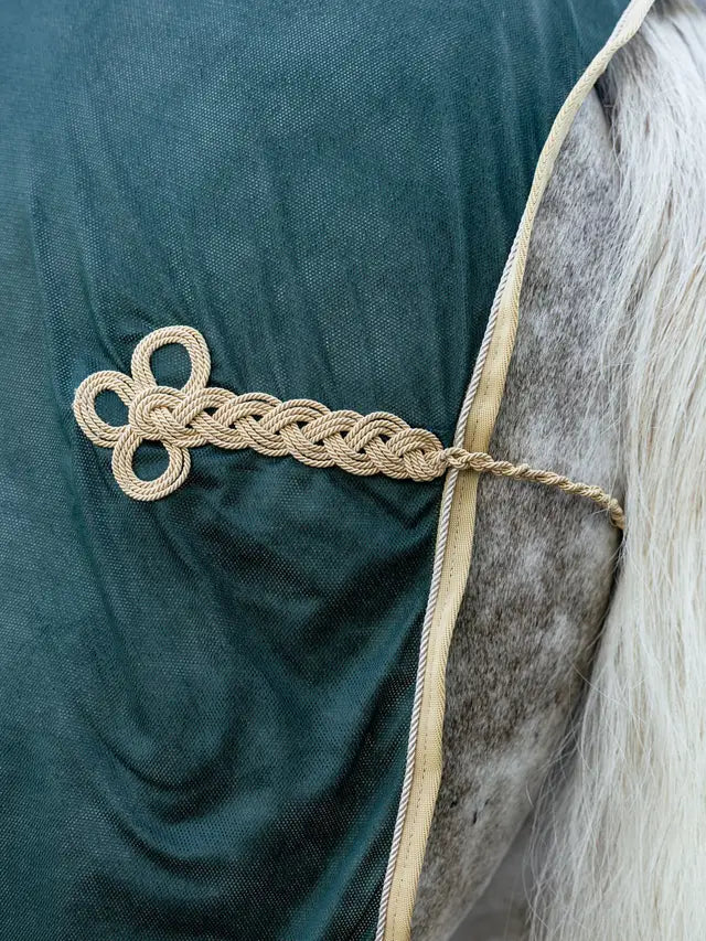 LEMIEUX SCRIM GREEN horse blanket detail: Elegant braided cord hip ornament on a lightweight mesh dress cooler.