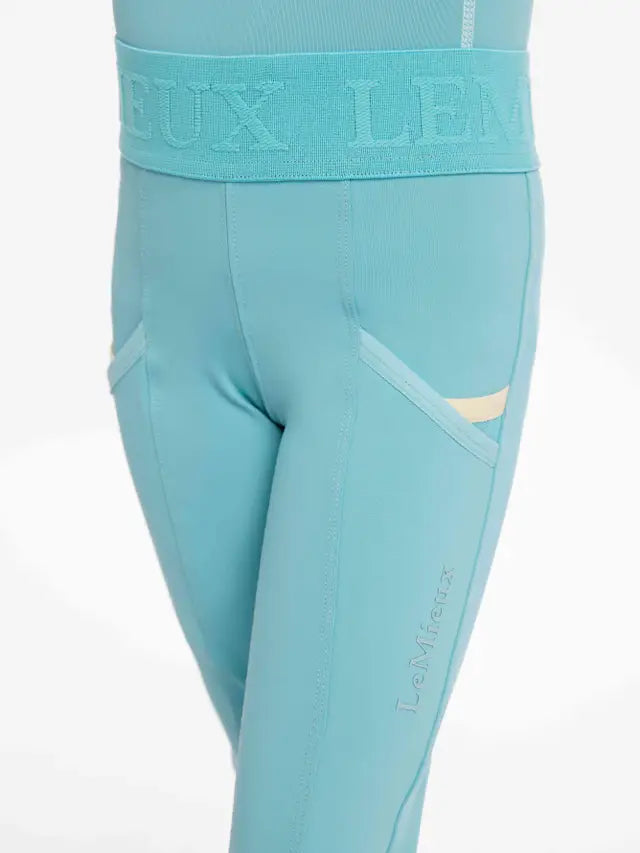 LeMieux Mini Lagoon Riding Leggings: Children's Equestrian Apparel. Aqua Blue Pull-on Breeches with Pockets.