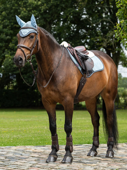 LeMieux Merino+ Suede Close Contact Glacier Saddle Pad on Brown Horse. Equestrian Riding Gear by Equiflair.