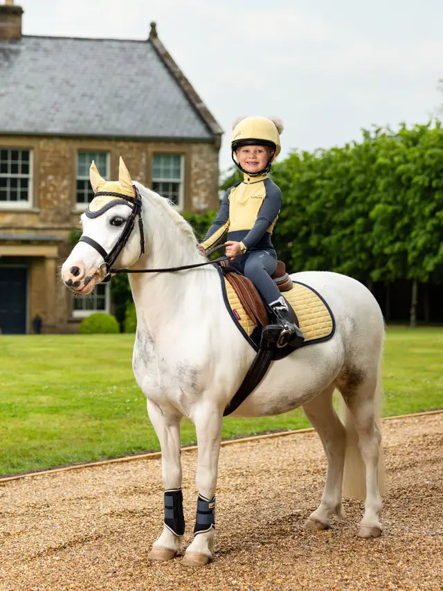 Child on Pony with LEMIEUX MINI SUEDE Saddle Pad in Mimosa | Equestrian Riding Gear | Equiflair Saddlery