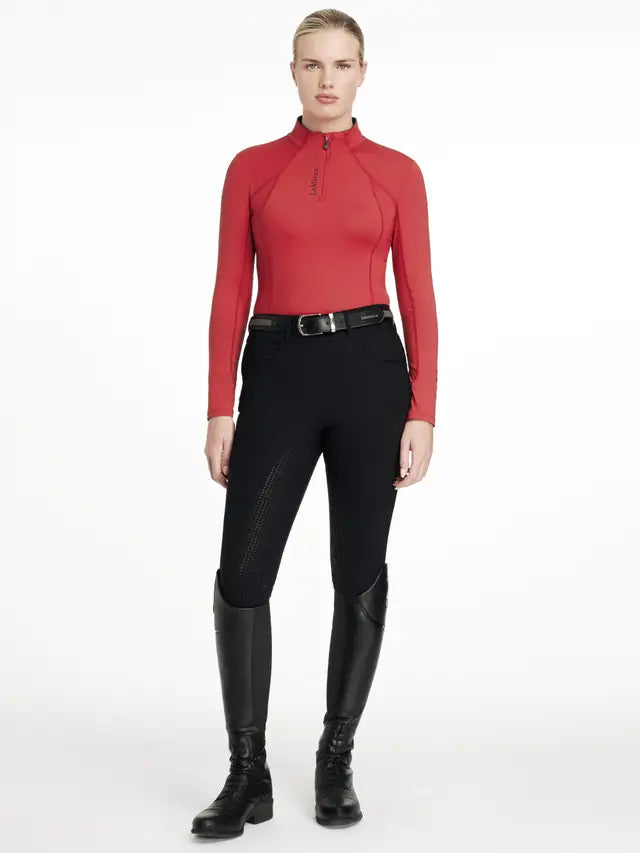 LeMieux Classique Chilli Base Layer: Red Quarter Zip Equestrian Shirt, Black Riding Breeches, Boots. Stylish Women's Riding Apparel.
