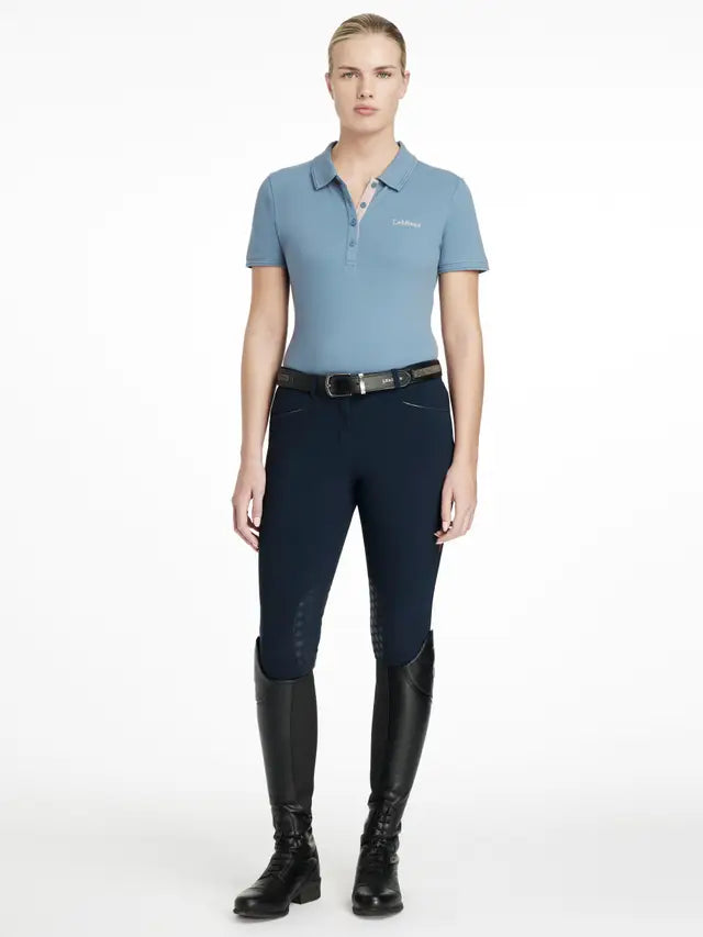 LEMIEUX CLASSIQUE POLO SHIRT ICE BLUE at Equiflair. Ladies equestrian polo shirt in ice blue, short sleeves. 