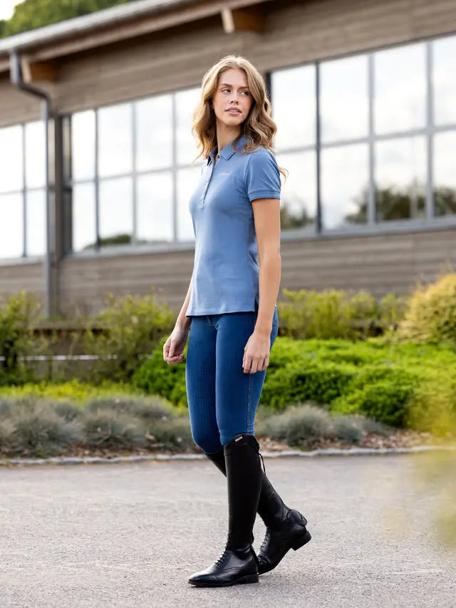LeMieux Classique Ice Blue Polo Shirt & Riding Boots. Woman in equestrian apparel. Equiflair store.