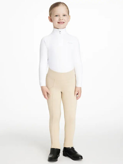 Young Girl in LEMIEUX White Base Layer & Beige Riding Breeches - Equestrian Apparel