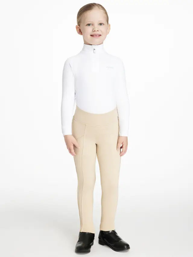 Young Girl in LEMIEUX White Base Layer & Beige Riding Breeches - Equestrian Apparel
